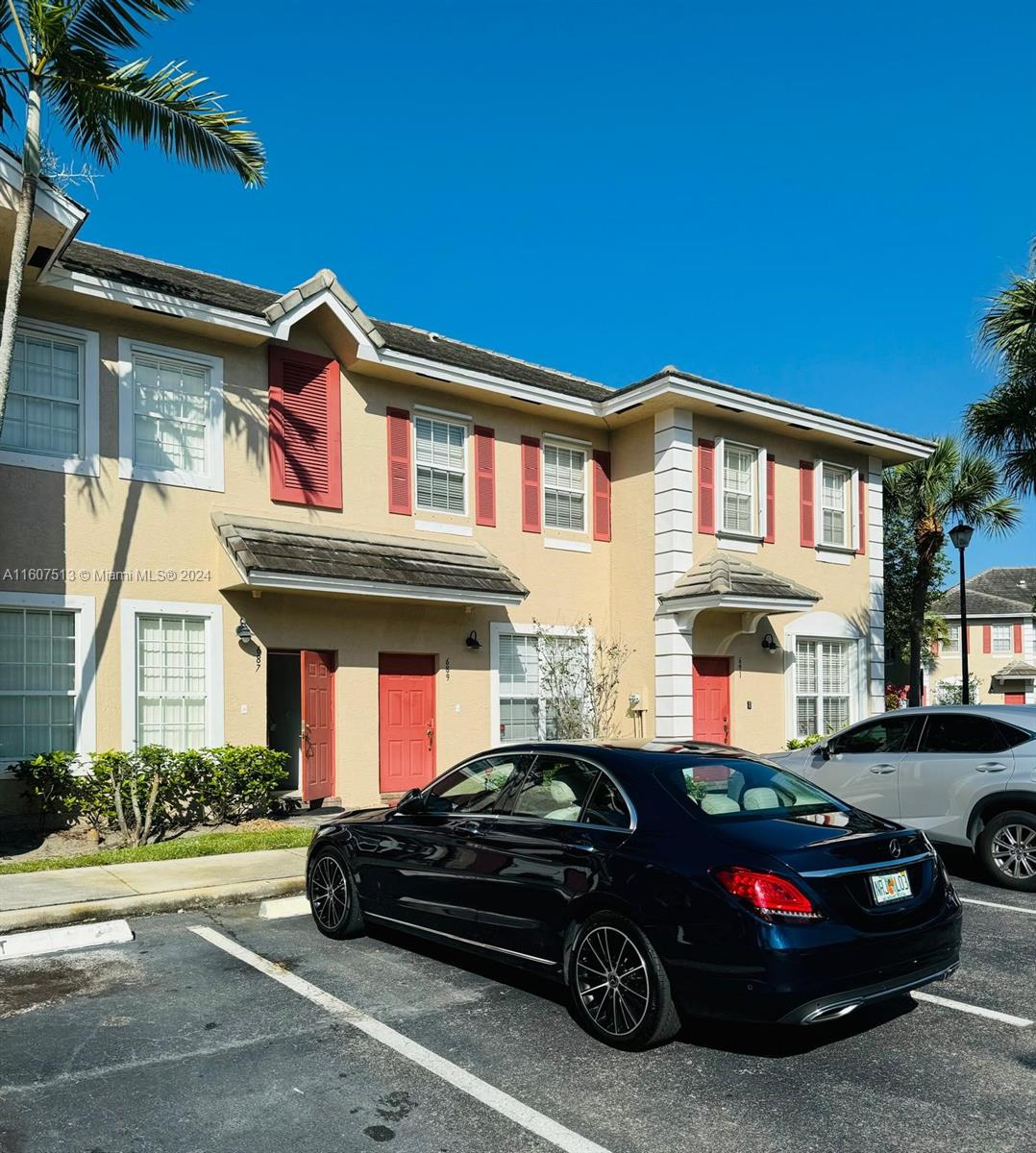 a car parked in front of a house