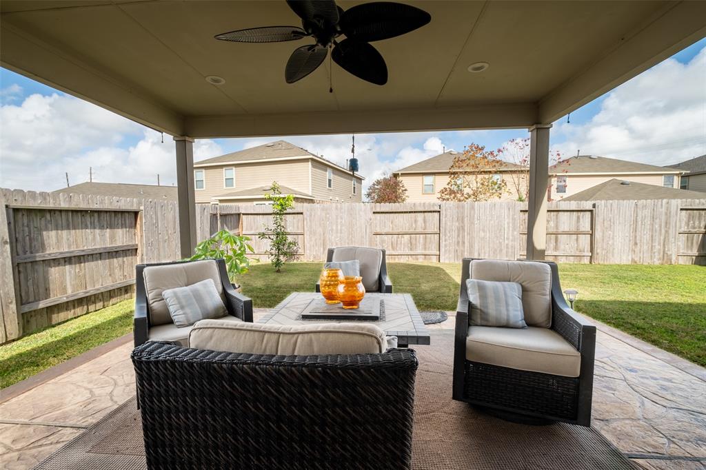 Spacious covered patio perfect for outdoor relaxation and entertaining.