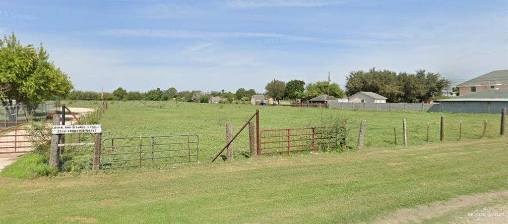 a view of a lake with a big yard