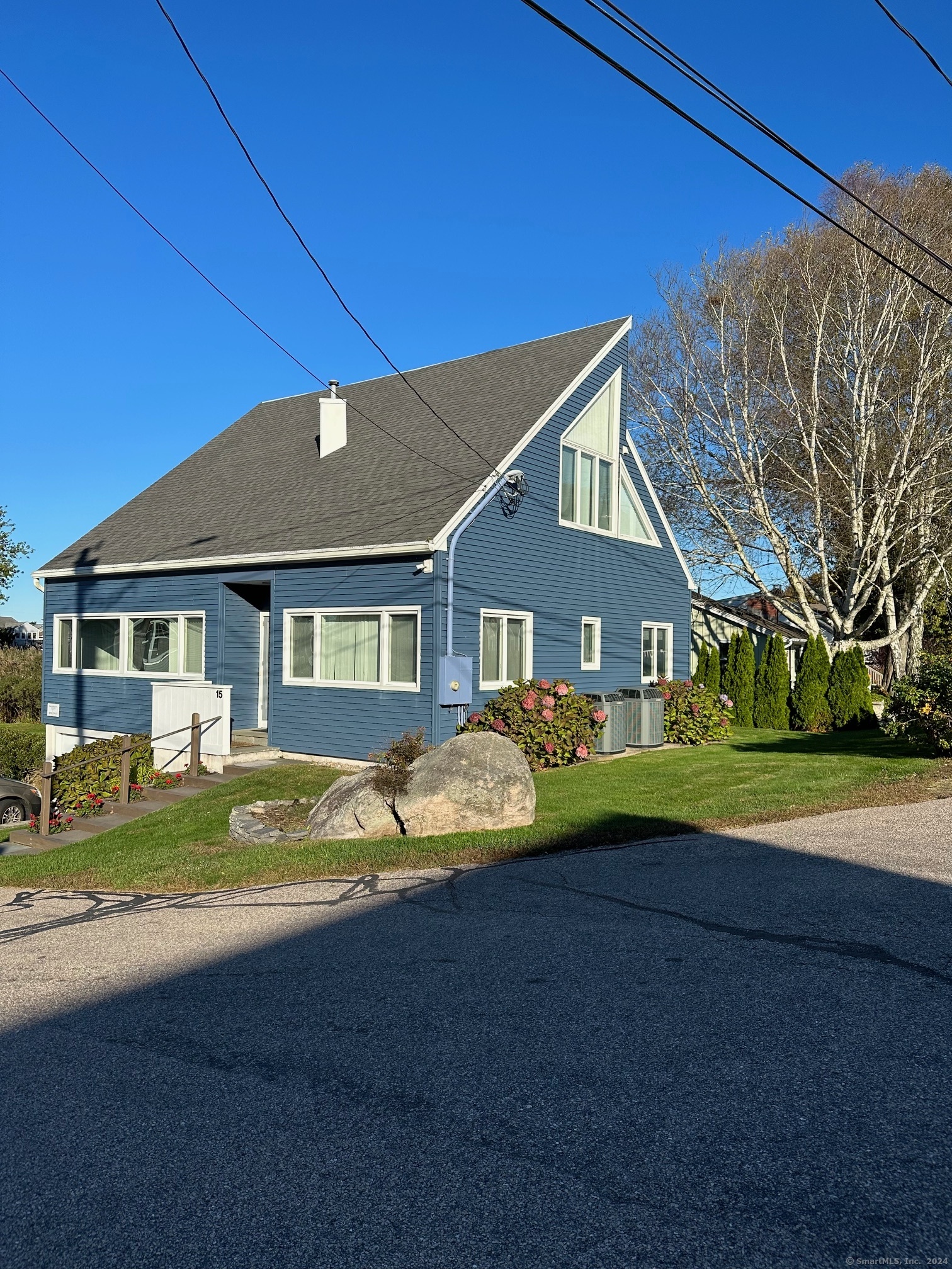 front view of a house next to a yard