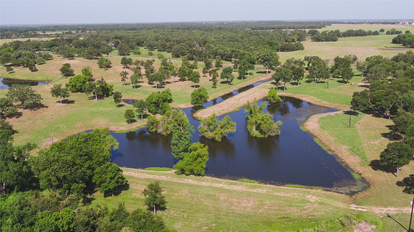 a view of a lake with a yard