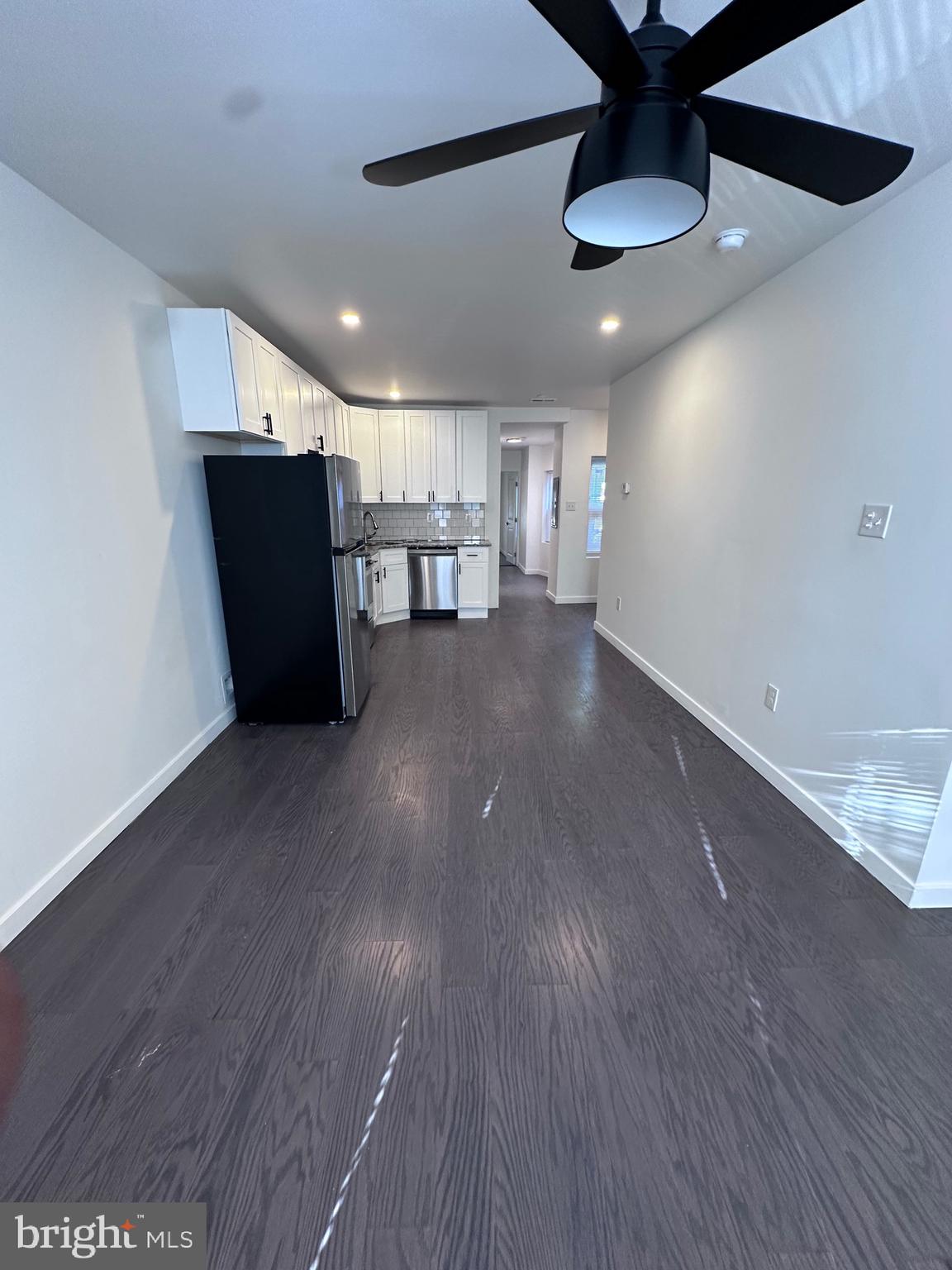 a view of a livingroom with furniture and wooden floor