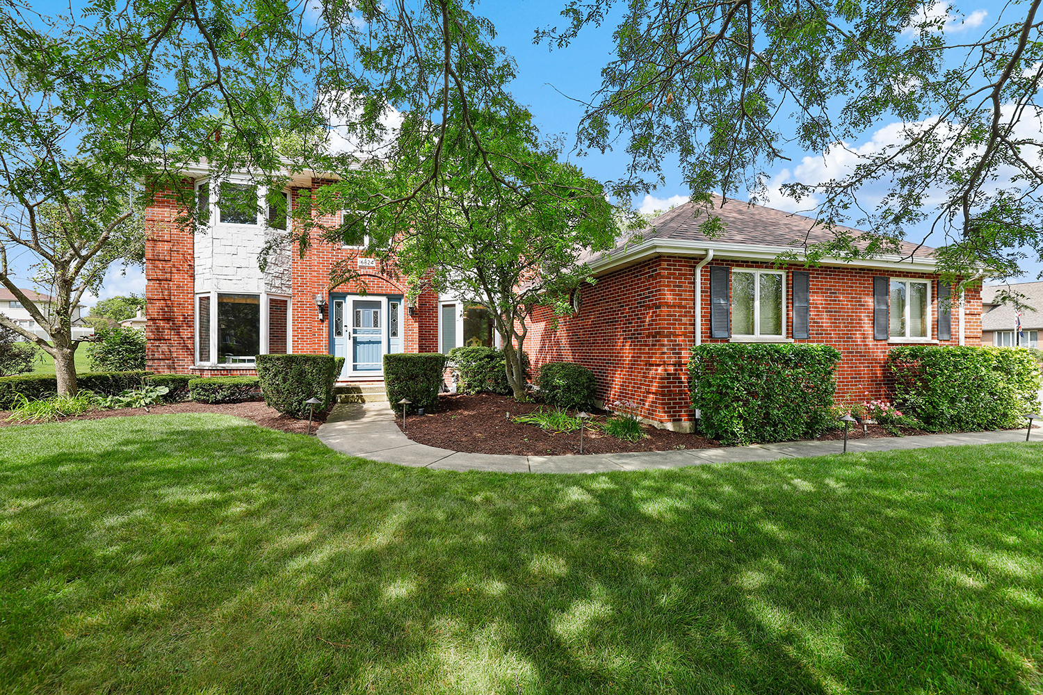 a front view of a house with a yard