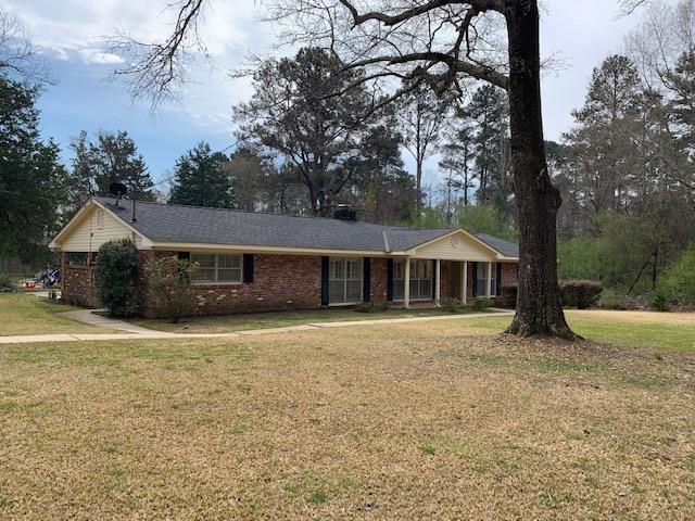 a front view of a house with yard