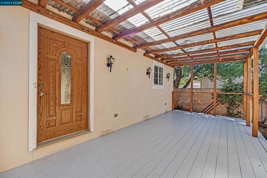 a view of a room with wooden floor and iron walls