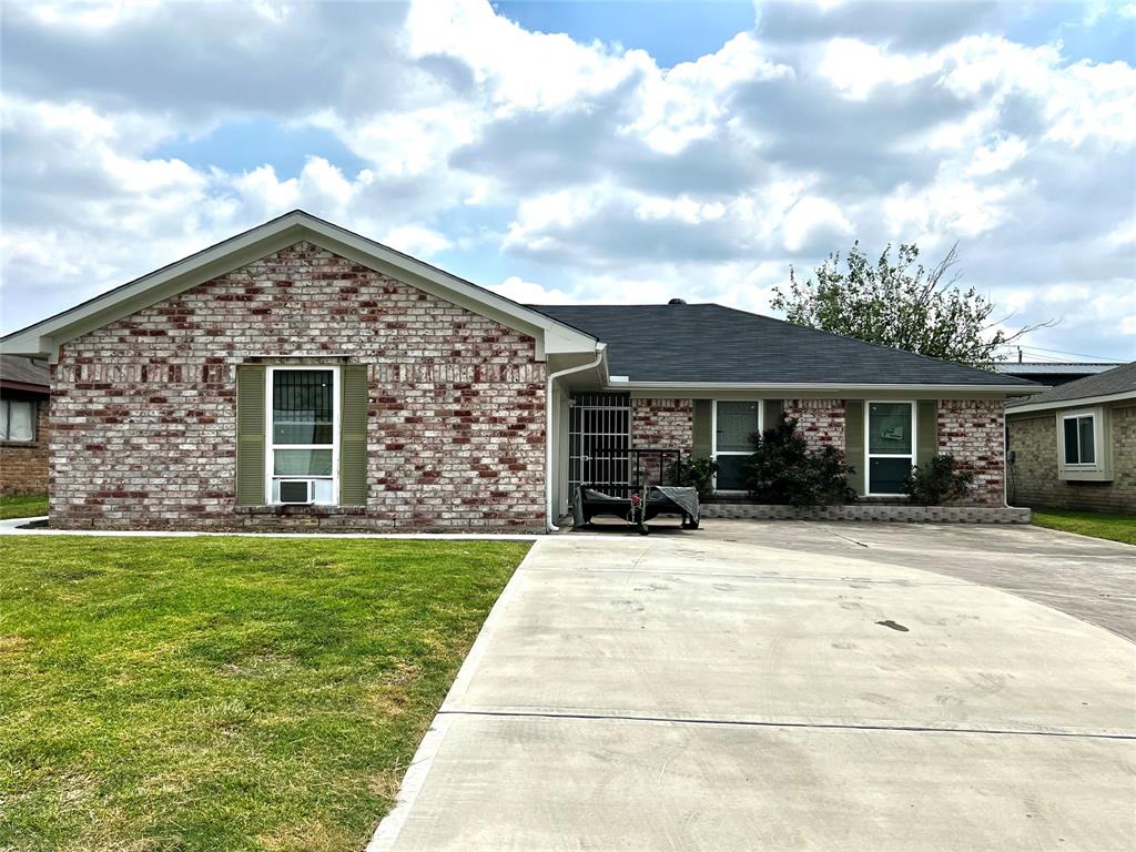 a front view of a house with yard