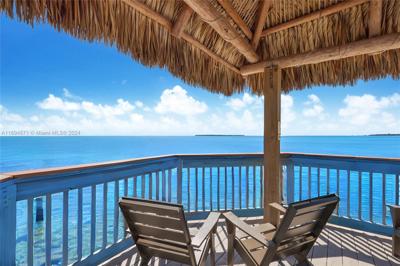 a view of a two chairs on the roof deck