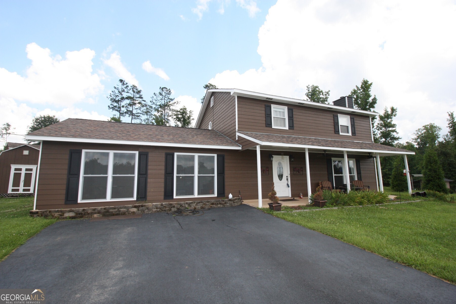 front view of a house with a yard