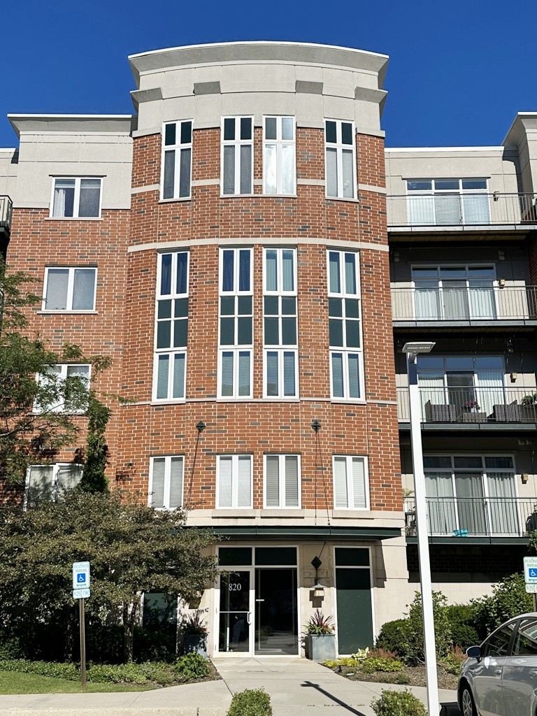 a front view of a building with balcony