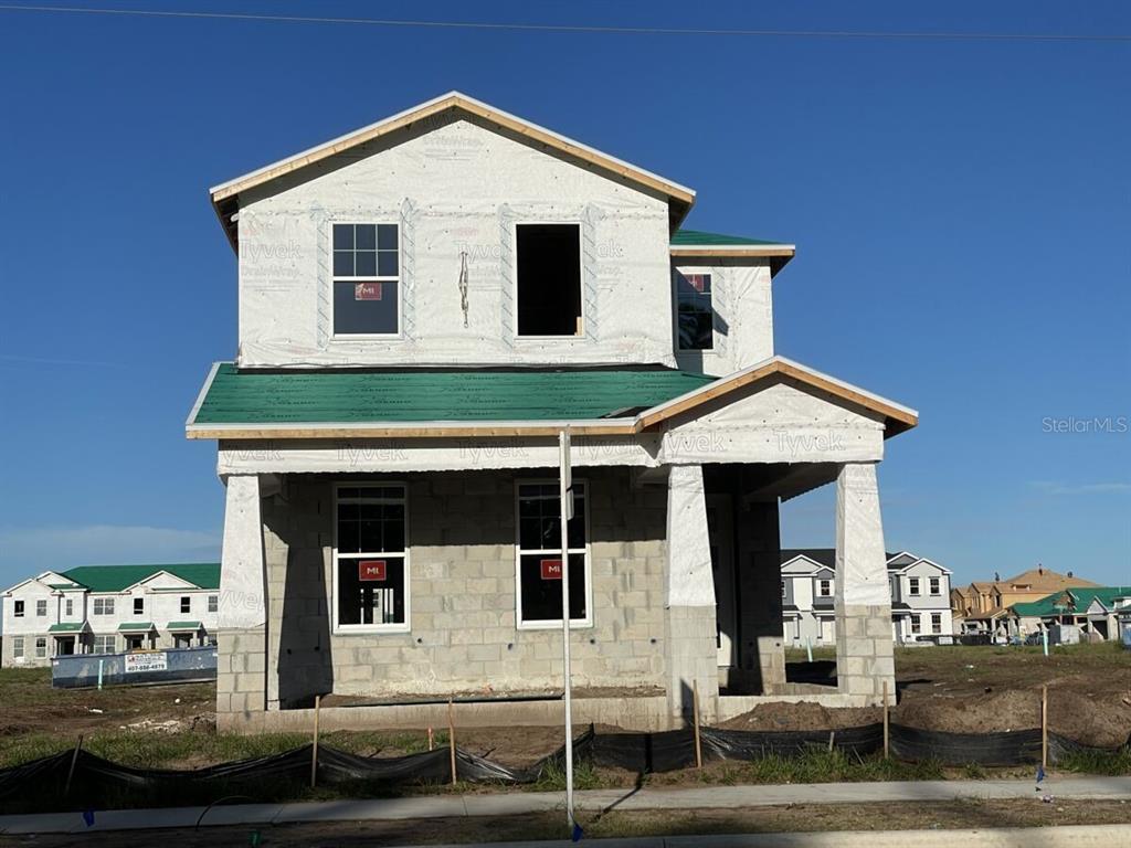 a front view of a house with garage