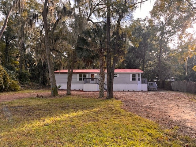 a house that has a tree in front of it