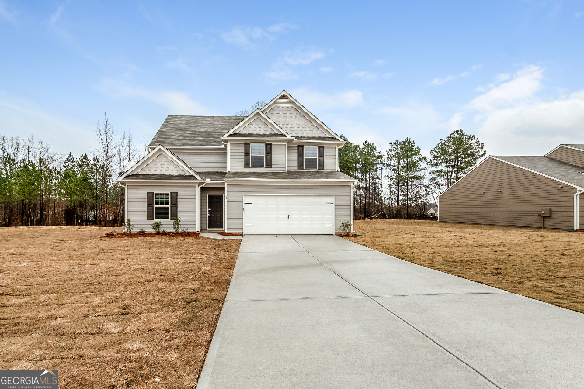 a front view of a house with yard