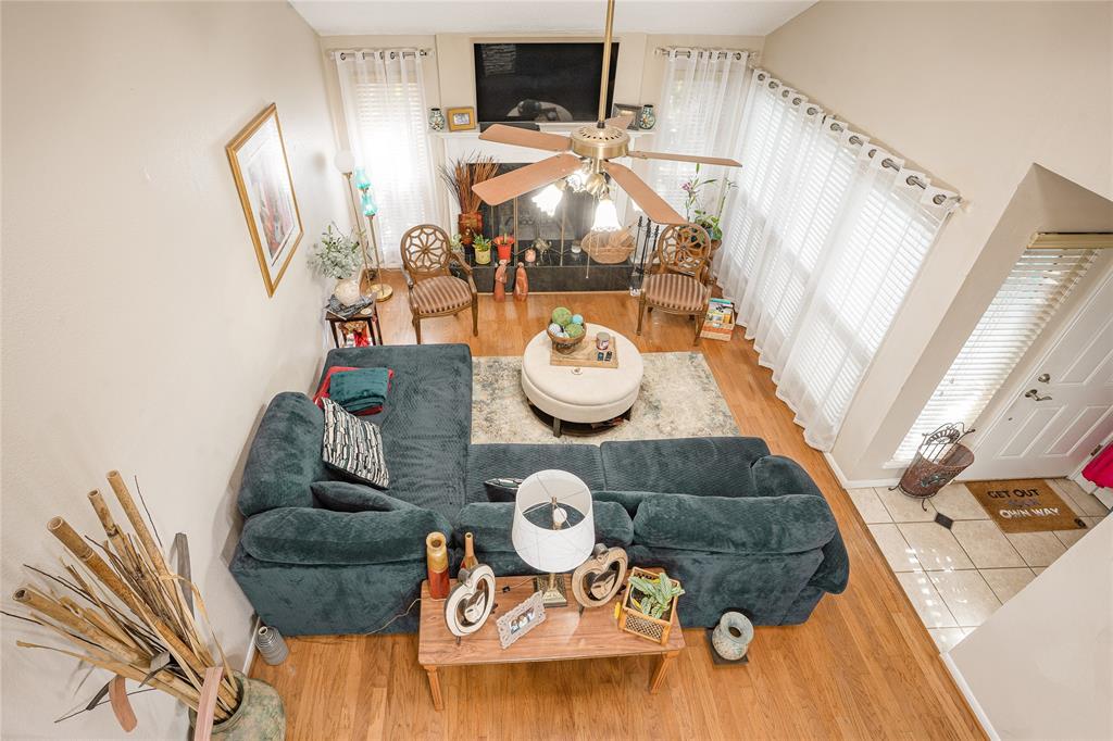 a living room with furniture and painting on the wall