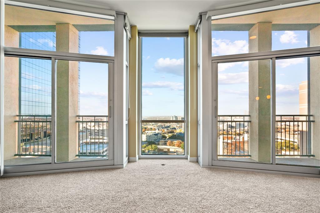 a view of an empty room with a window