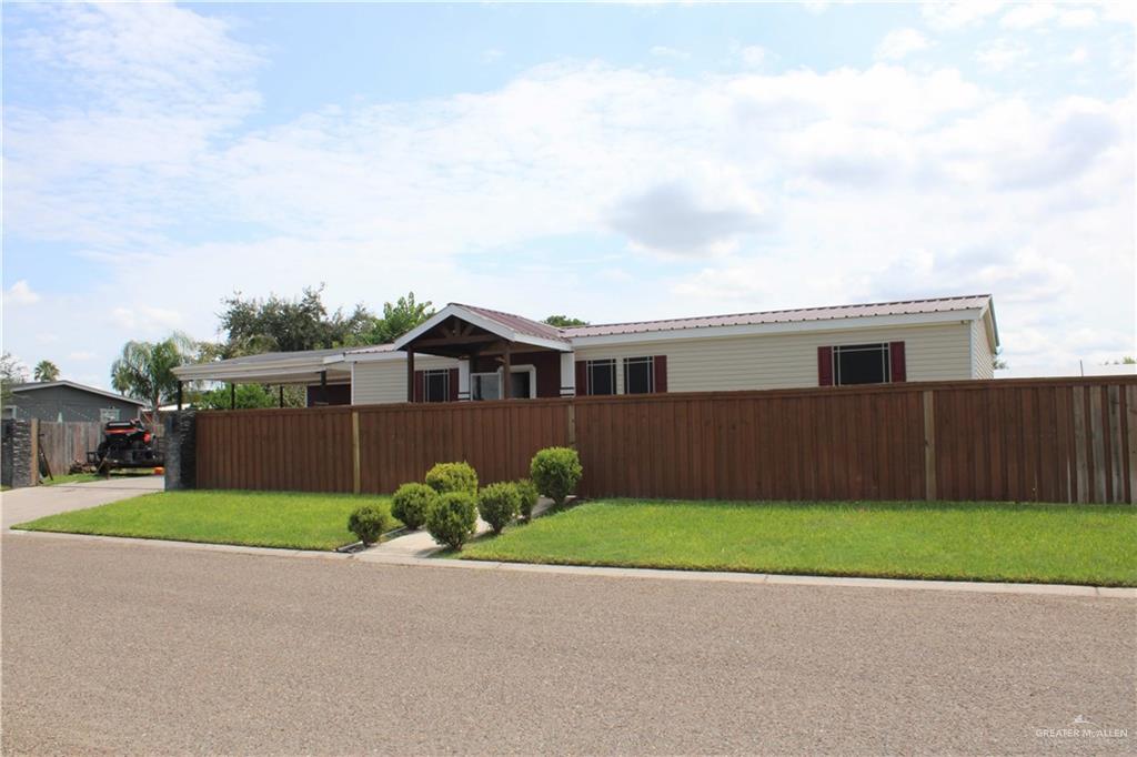 View of front of property featuring a front lawn