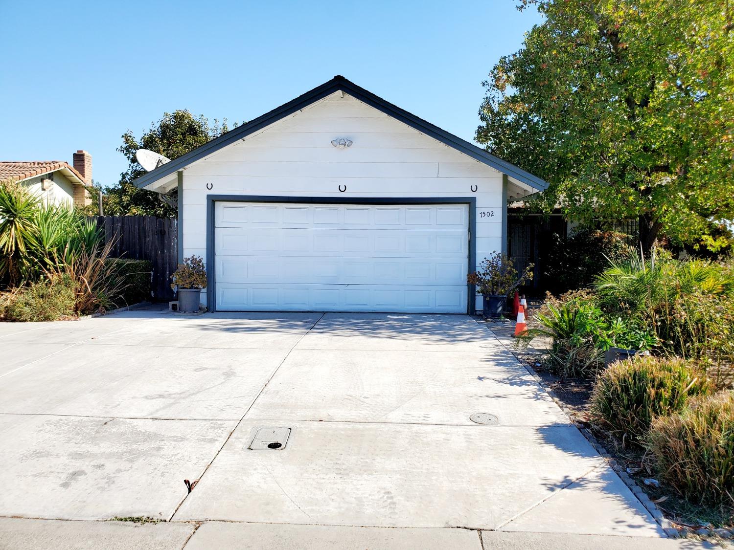 a front view of house with garage