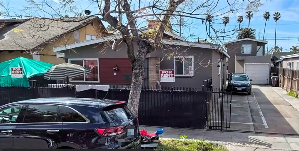 a view of a car park in front of house