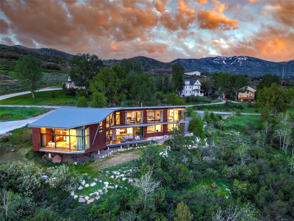 an aerial view of a house with a garden