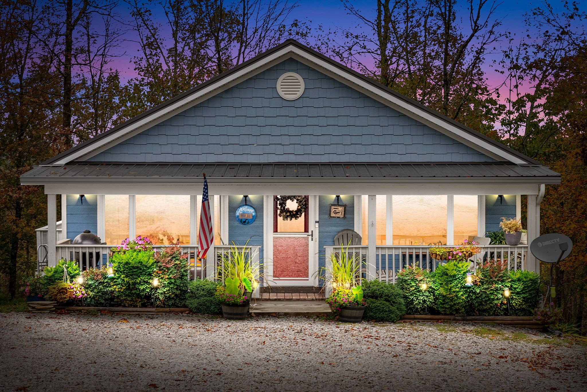 a front view of a house with garden