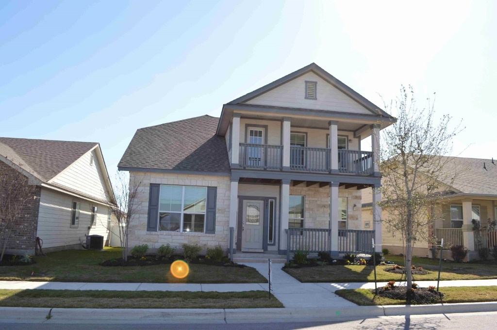 a front view of a house with yard