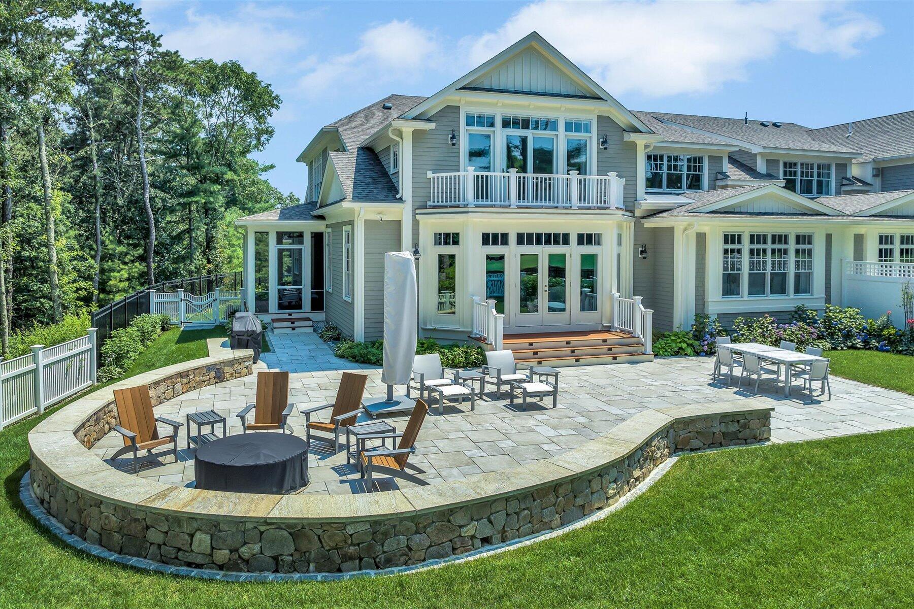 a view of a house with swimming pool and sitting area