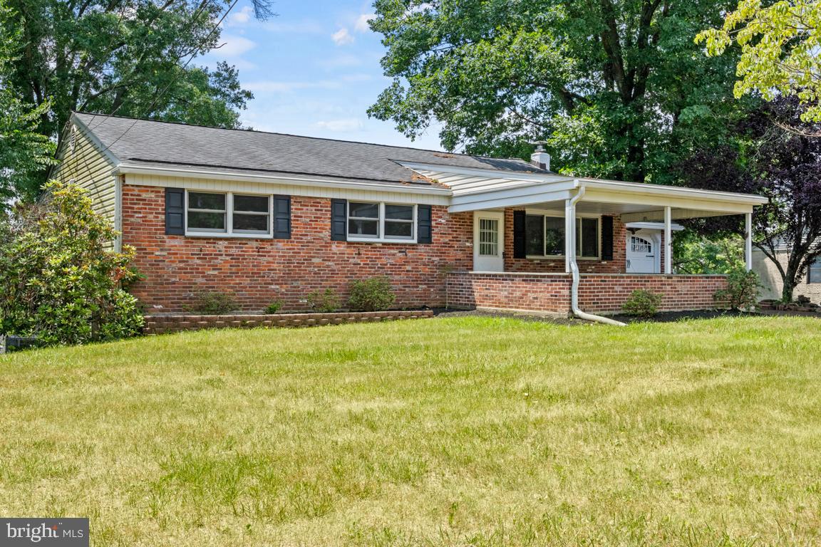 a front view of house with yard and outdoor seating