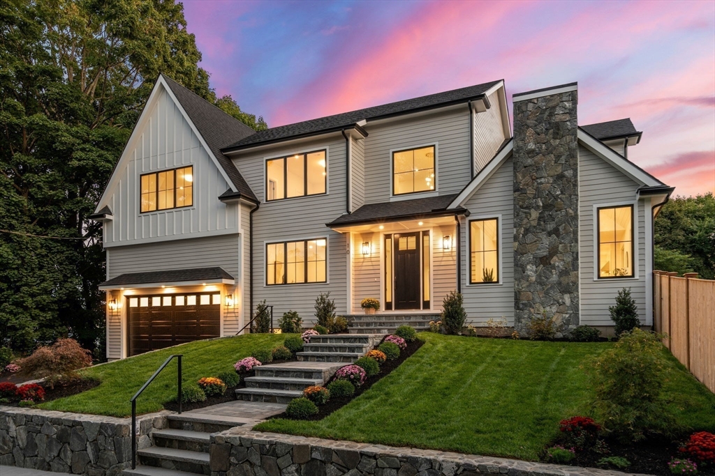 a front view of a house with a yard