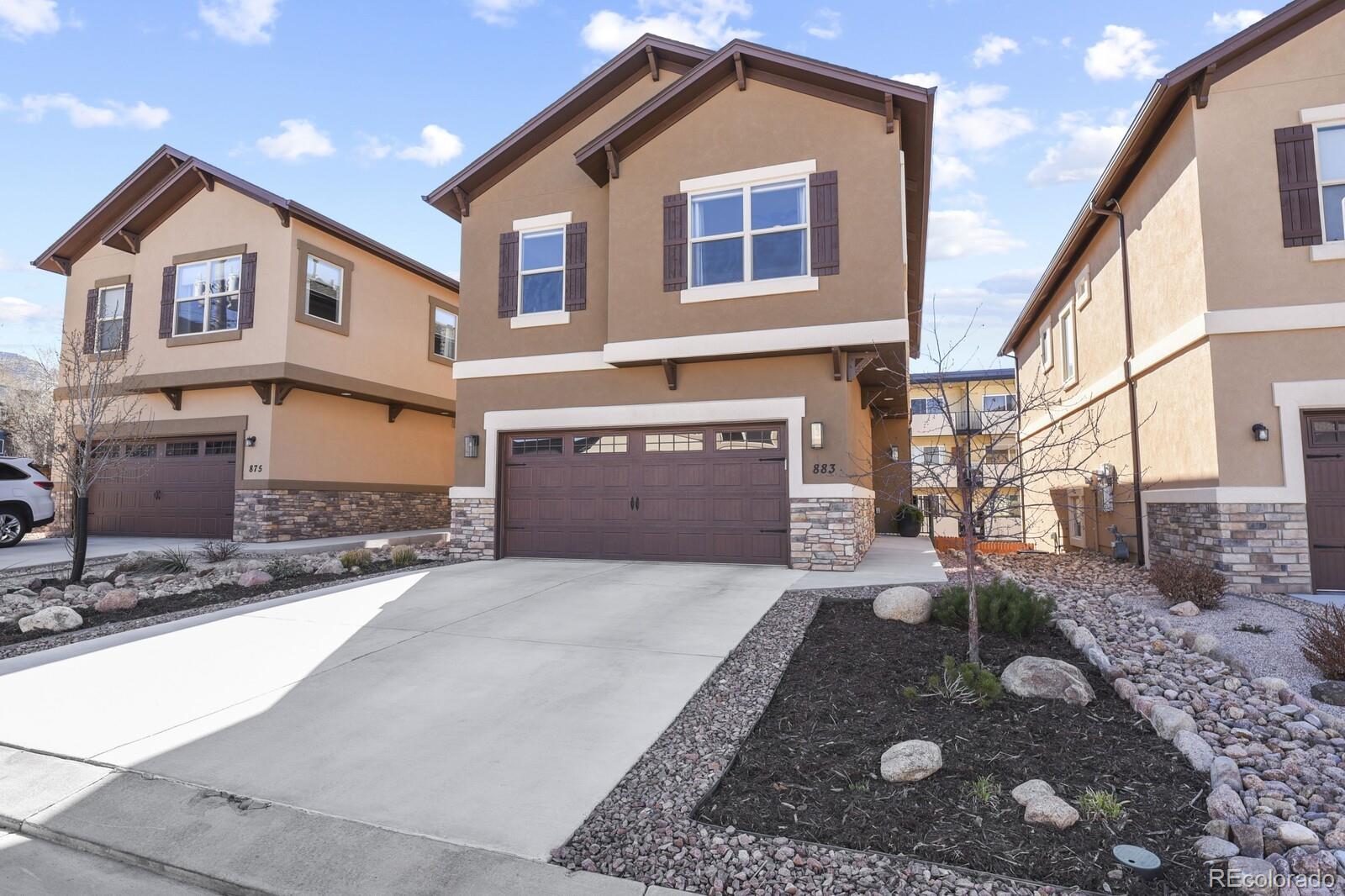 a front view of a house with yard