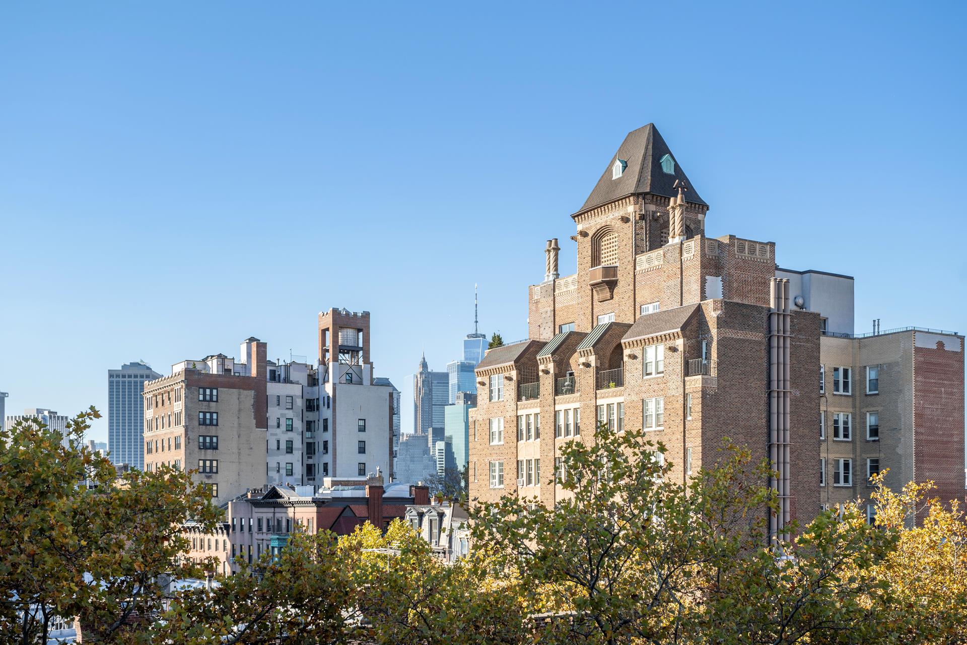 a view of a city with tall buildings in the background