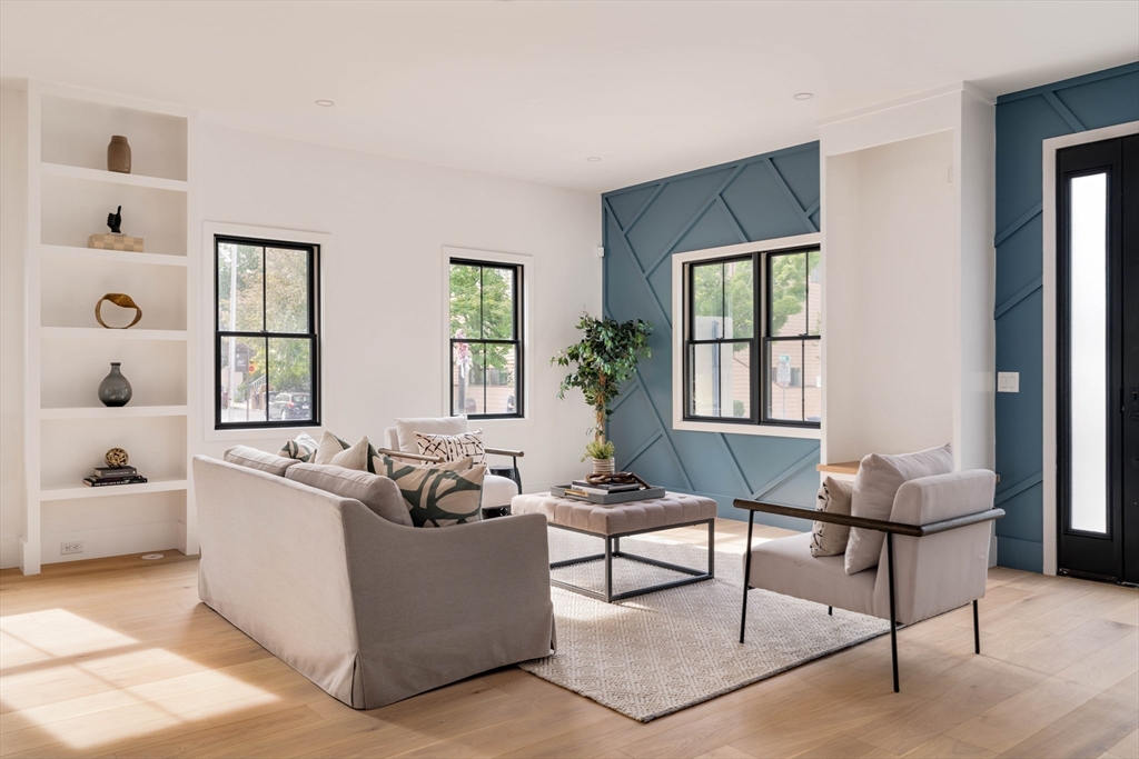 a living room with furniture and windows