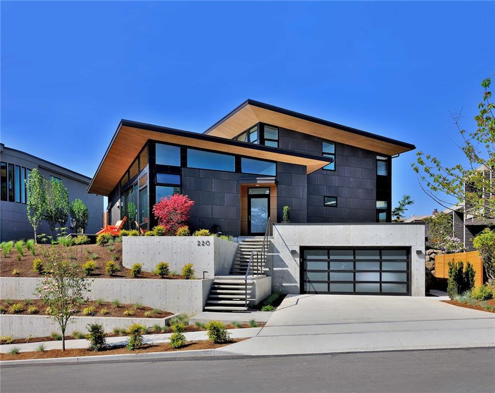 a front view of a house with garage