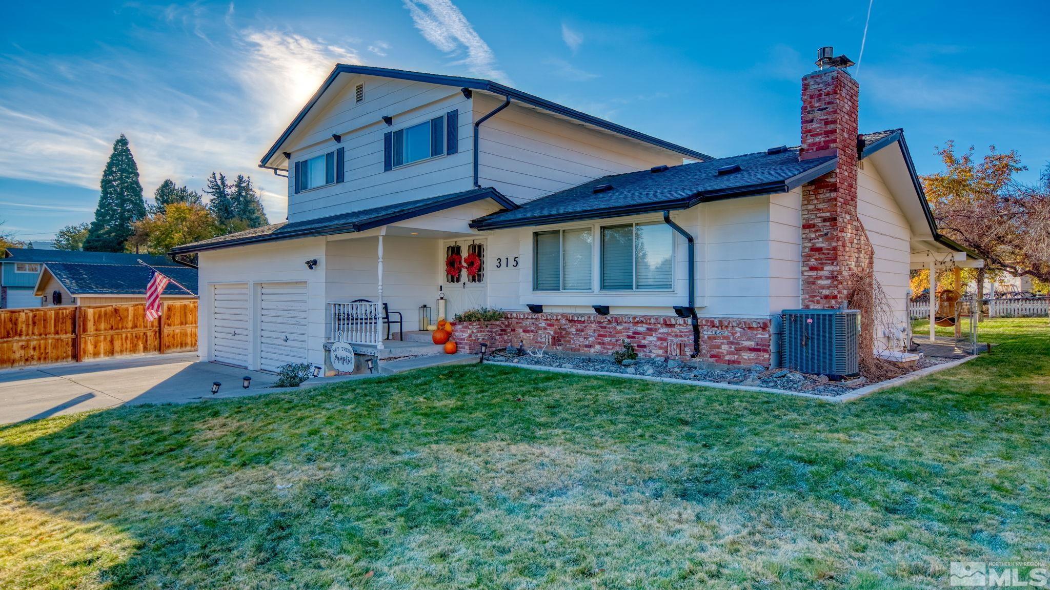 a front view of house with yard and entertaining space