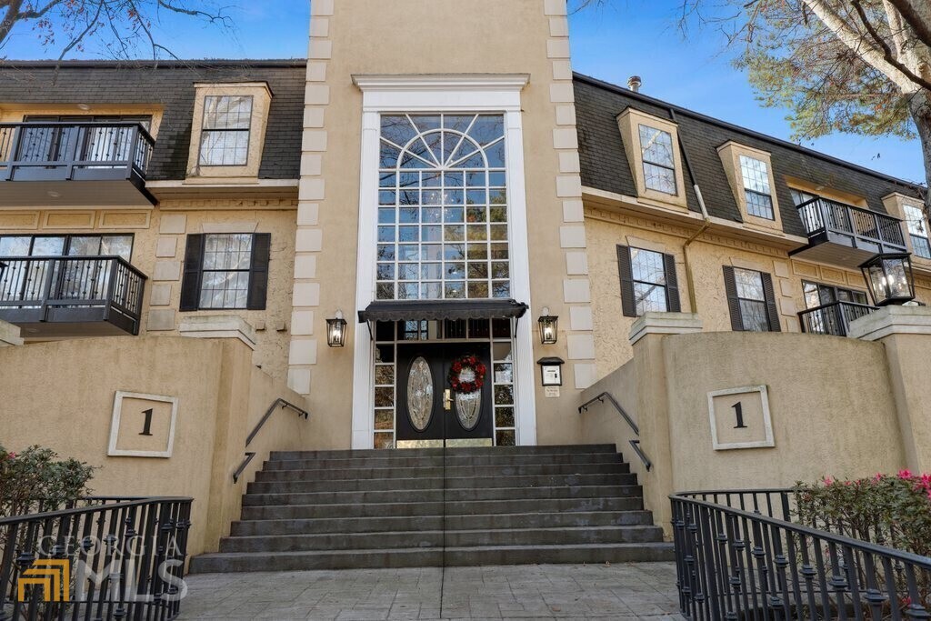 a front view of a house with a stairs