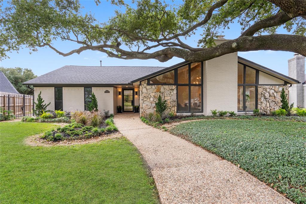 Welcome to 718 Center Hill Drive! This timeless Mid Century Modern home has been modernized with luxurious finishes!