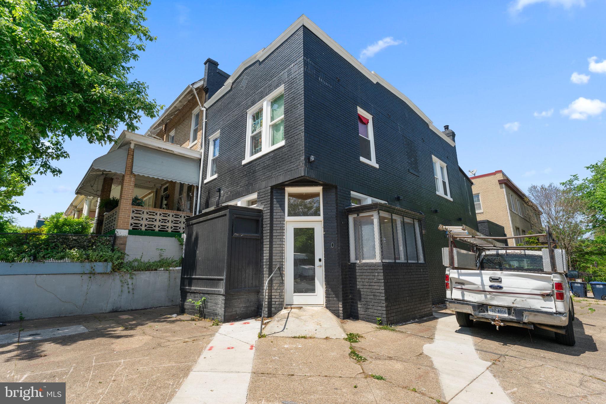 a front view of a house with parking