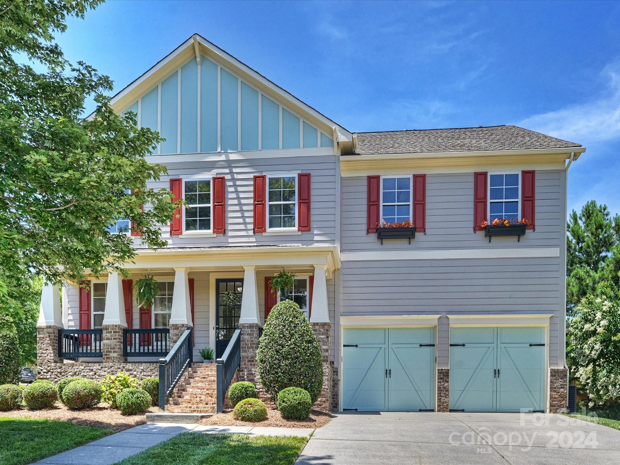 a front view of a house with yard porch and seating space