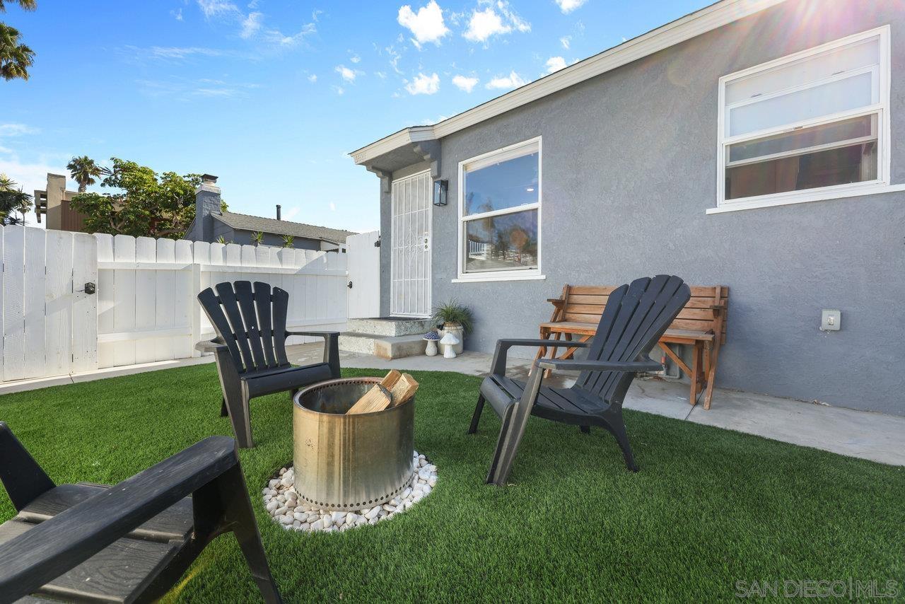 a view of a patio with table and chairs