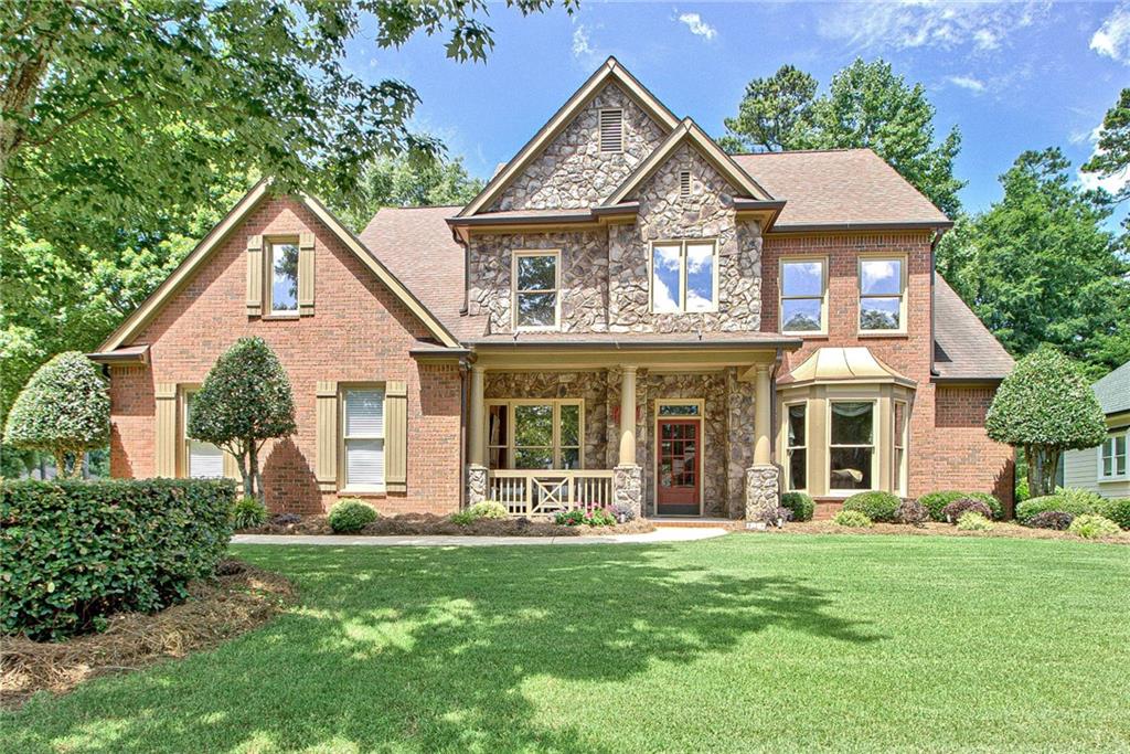 front view of a house with a yard