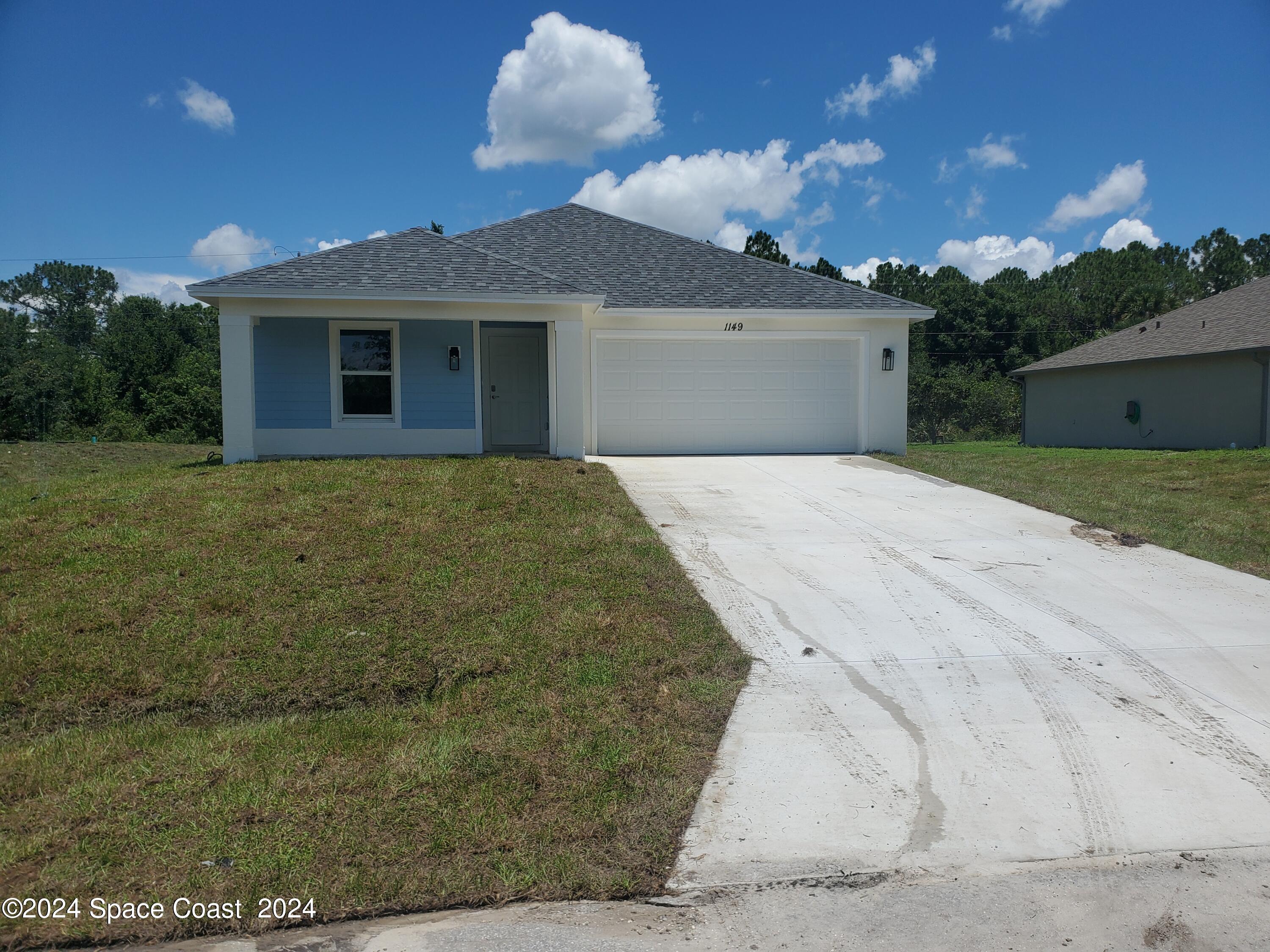 front view of a house with a yard