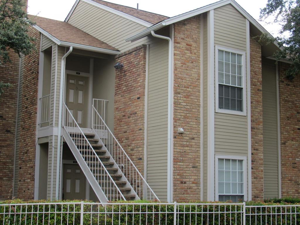 a view of a balcony with stairs