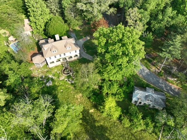 an aerial view of a house with yard