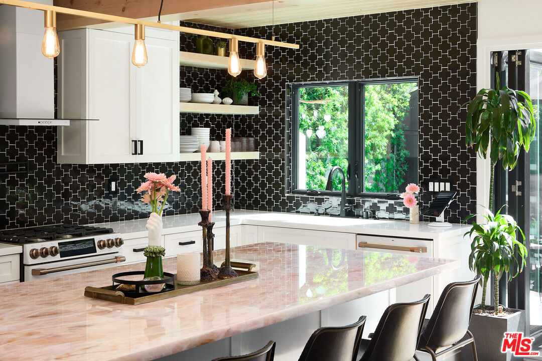 a kitchen with a table and chairs