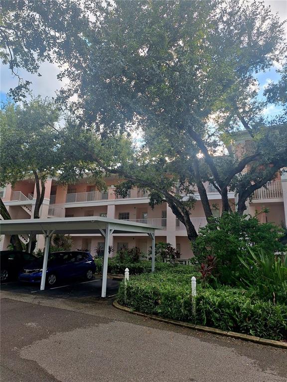 a view of a car park in front of house