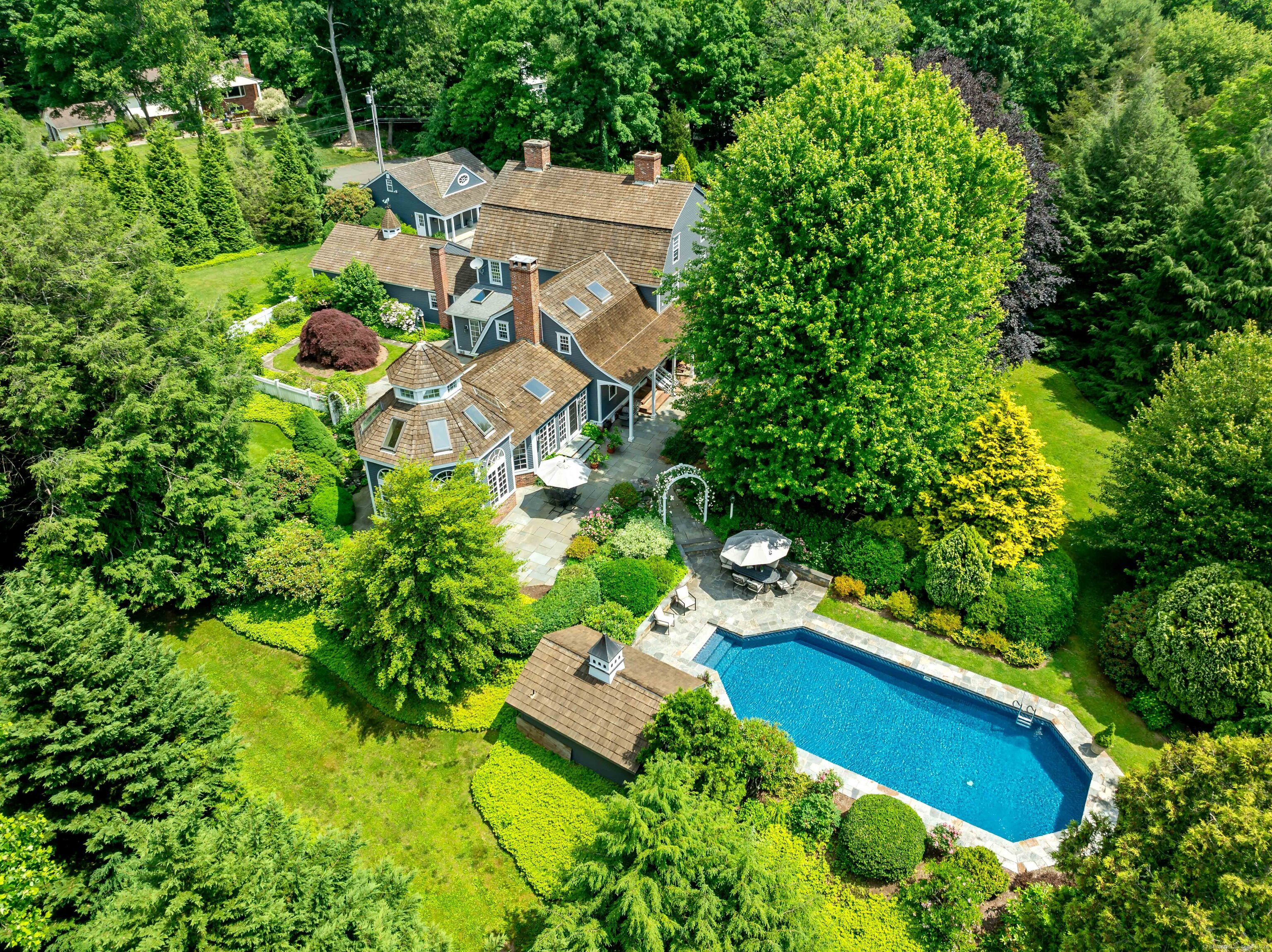 an aerial view of a house with a garden