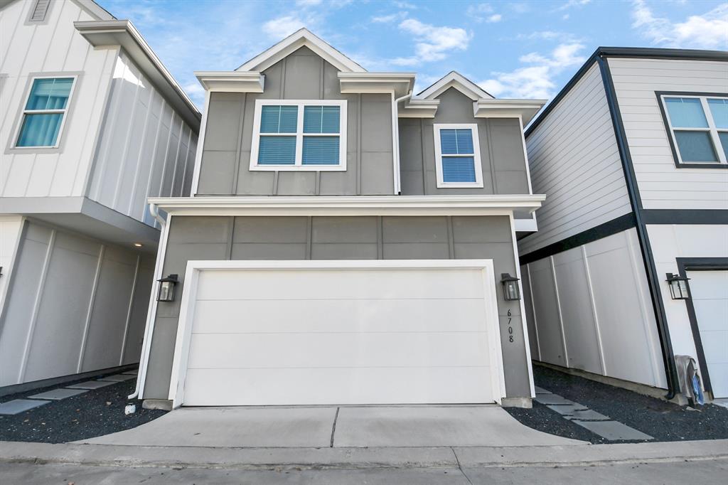 a front view of a house with a garage