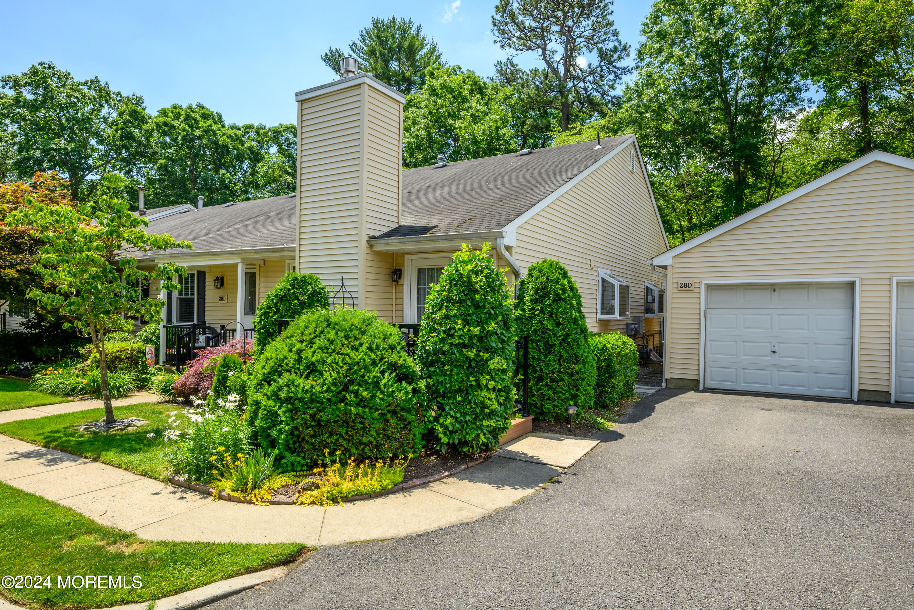 a view of a house with a yard and garage