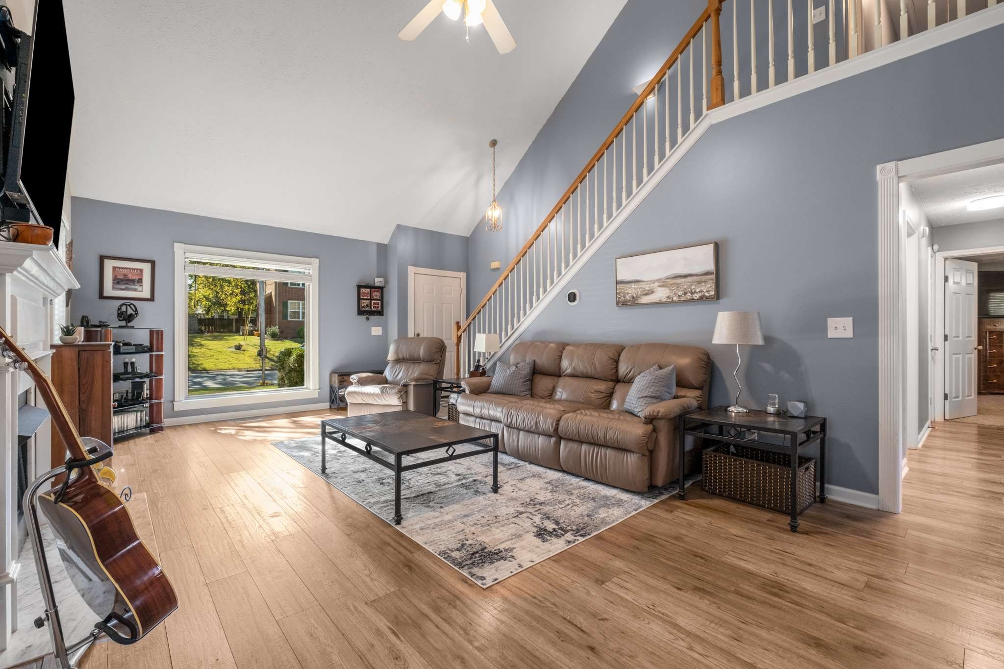 a living room with furniture and a flat screen tv