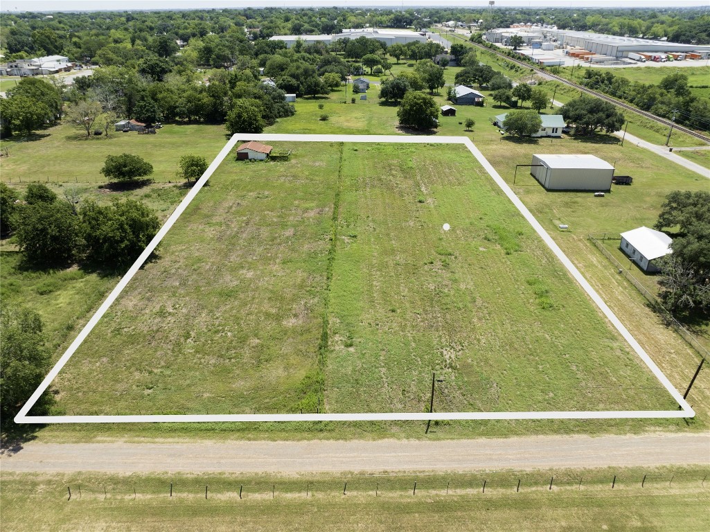 a view of a swimming pool with a yard