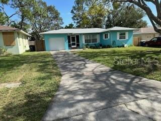 a view of a house with a yard