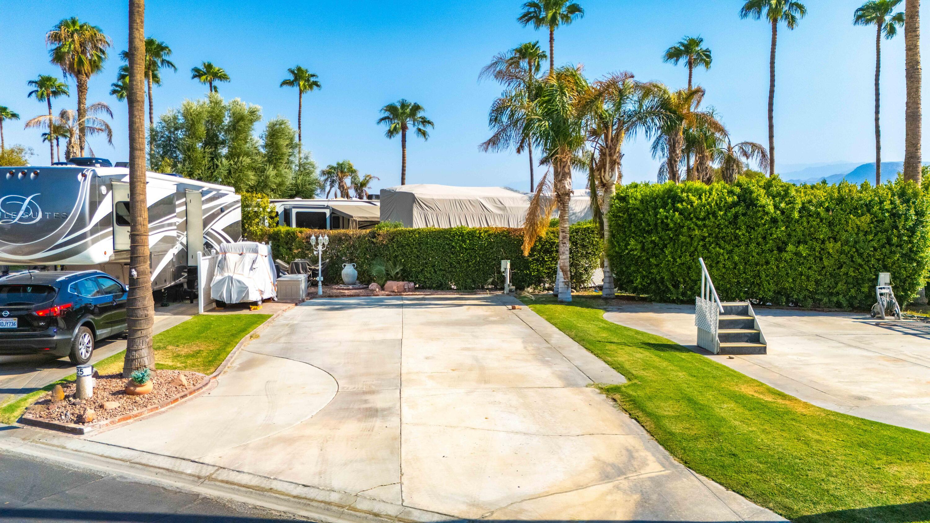 a swimming pool with outdoor seating and yard